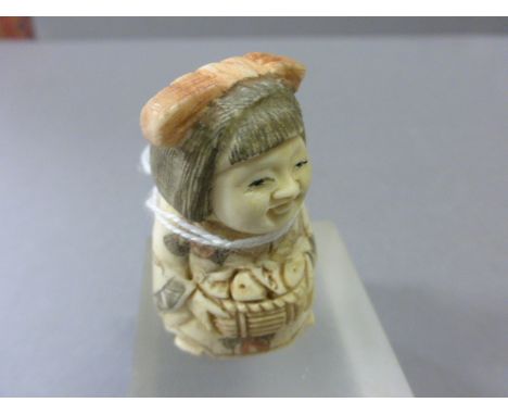 Signed Oxbone Netsuke of a Lady Trader with Basket