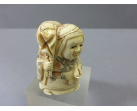 Signed Oxbone Netsuke of a Lady carrying Sack