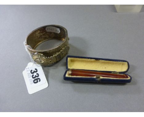 Victorian White Metal Bangle in the form of a Belt together with a Cased Amber Cheroot with Yellow Metal Rim