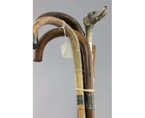 Two Walking Sticks with Silver Bands, another Walking Stick and a Shoe Horn with Dog Head Handle (a/f)