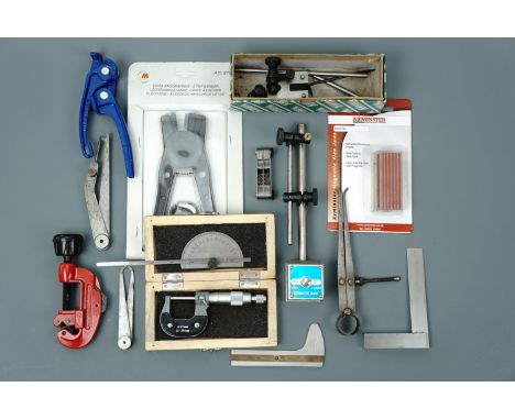 Tools including a micrometer, surface gauge, pipe cutter and pipe bender etc