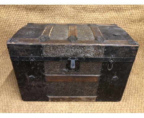 A fine Victorian luggage trunk of diminutive stature, decorated with embossed sheet brass panels and steel mounts, having and
