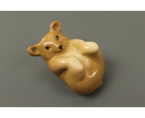 A vintage WR Midwinter bear cub modelled in a playful roll, third quarter 20th Century, 8 × 5 cm