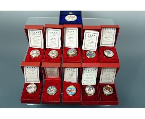 Eleven Halcyon Days enamel Christmas boxes, 1990 - 2000, boxed with documents