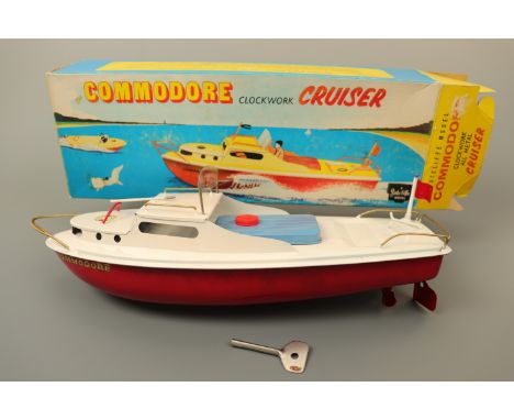 A Sutcliffe Model "Commodore" clockwork cruiser tinplate toy boat, in original carton
