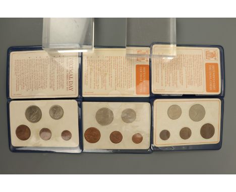 Three "Britain's First Decimal Coins" packs together with Whitman GB coin collecting folders