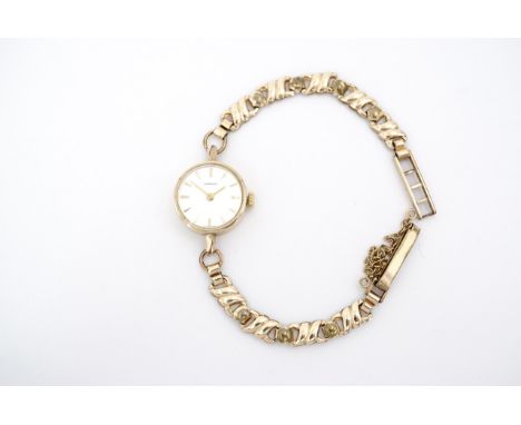 A vintage lady's Longines wristlet watch, having a calibre 410 manual movement and gold plated case and strap, (running)