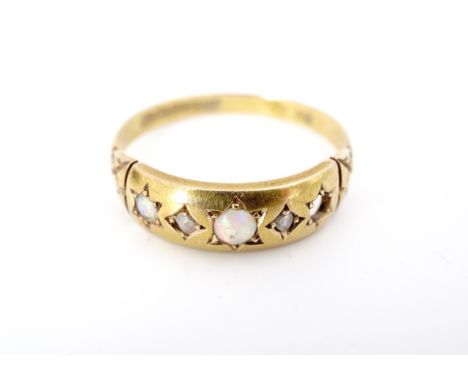 An antique 15ct gold, opal and old-cut diamond dress ring, the face gypsy set in an alternating arrangement, and flanked by e