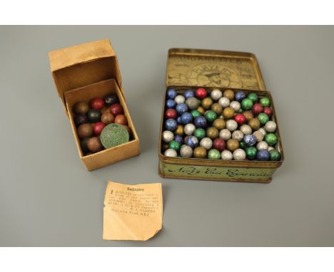 Vintage glass and ceramic marbles / game pieces, a quantity contained within a Player's Navy Cut cigarette tin