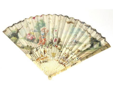 Pastoral Idyll: An Early 18th Century Ivory Fan, with carved guards and a carved, pierced and painted gorge. The front guard 