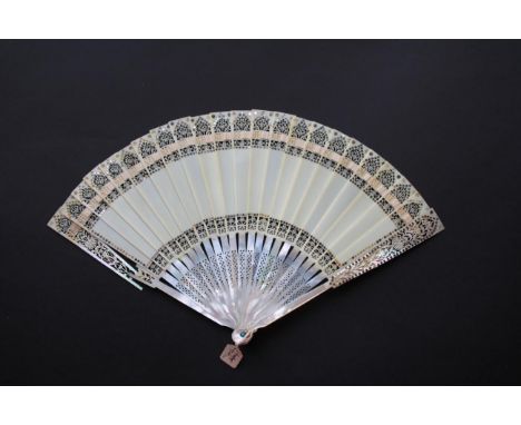 A Mother-of-Pearl and Ivory Fan, circa 1900(?), of a very unusual type. The monture is made up of white mother of pearl guard