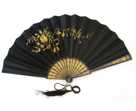 An Early 19th Century Bone Fan, the guards and gorge simply carved and pierced with flowers. The double paper leaf, with thre