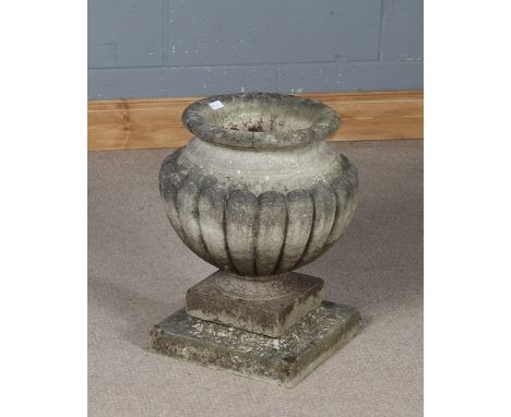 Reconstituted stone planter with bulbous gadrooned body, 43cm high