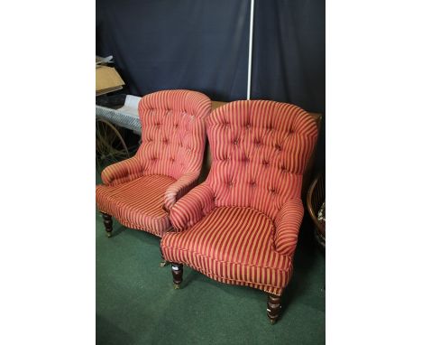 Pair of early 20th Century upholstered button back chairs, raised on turned legs with castors and saber legs (2)