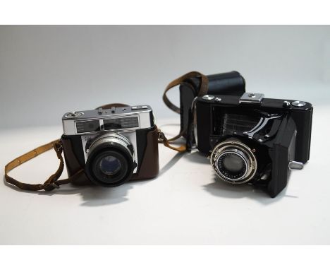 A Zeiss Ikon Telma camera, a Zeiss Tessa 2.8/50 camera, and a light meter