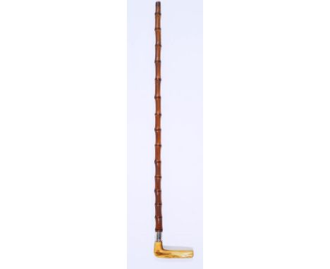 A walking stick with horn handle and silver (rubbed) band