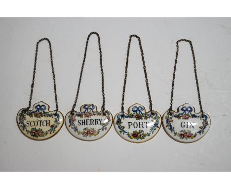 A set of four Crown Staffordshire ceramic decanter labels