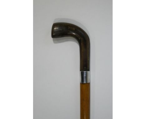 A heavy malacca walking stick with horn handle and 1" silver collar, (date rubbed)