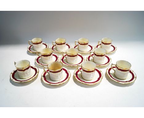 A Royal Crown Derby Mercers Company coffee service, comprising eleven cups and twelve saucers, pink banding with gilt detail