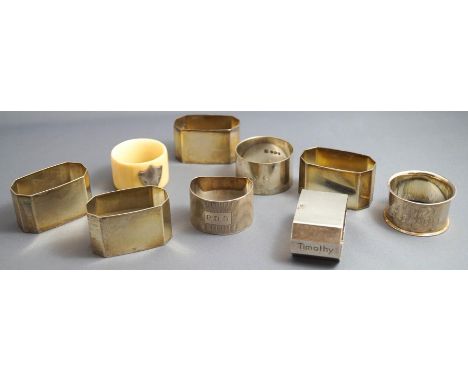 A silver napkin ring, of engine turned decorated D shape; two plain silver napkin rings; a set of five napkin rings, stamped 