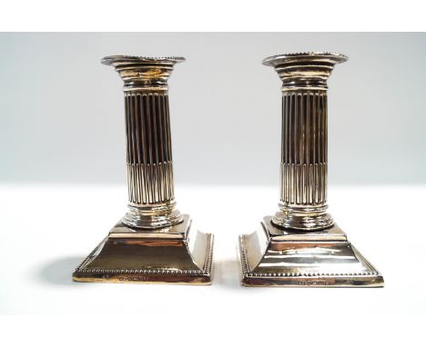 A pair of Victorian loaded silver desk candlesticks, by Harrison Brothers and Howson, Sheffield 1883, 13 cm high