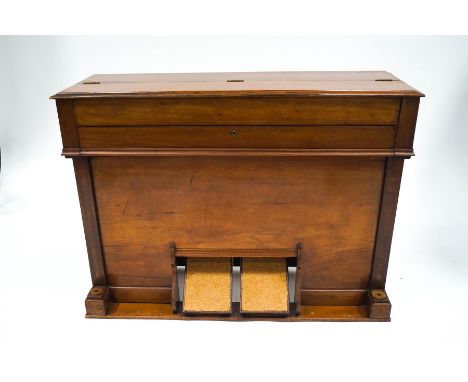 A Wade and Meggitt Edwardian harmonium in walnut case with two brass handles, 72cm high x 105cm wide x 34cm deep