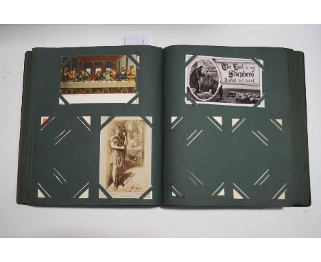 A postcard album of Victorian and later cards, including WWI, HMS war ships, steam railway,  Louis Wain, Mabel Lucie Attwell,