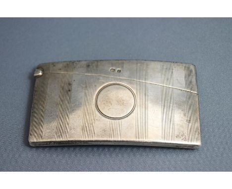 A silver card case, by George Unite, Birmingham 1908, of rectangular curved form with linear engine turned decoration, vacant