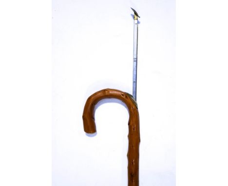 A simulated wood horse measuring walking stick