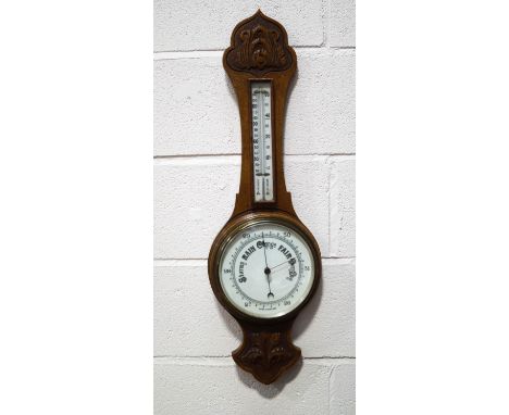 An oak banjo barometer with carved case and subsidiary thermometer, 82cm high