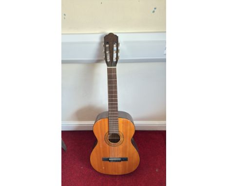 Vintage classical acoustic guitar by Hohner, model "Musima," featuring spruce top and rosette detailing.