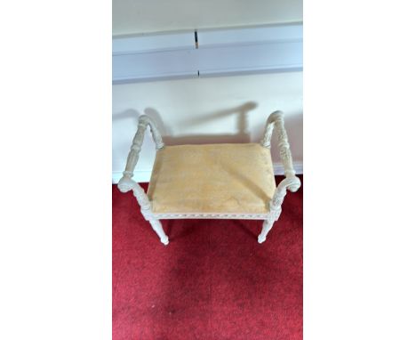 Carved painted wood window bench with scroll arms and upholstered seat, in Neoclassical style with acanthus detailing and ros