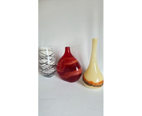 Trio of contemporary art glass vases, featuring bold freeform designs in crimson, bone, and monochrome. Hand-blown, modern st