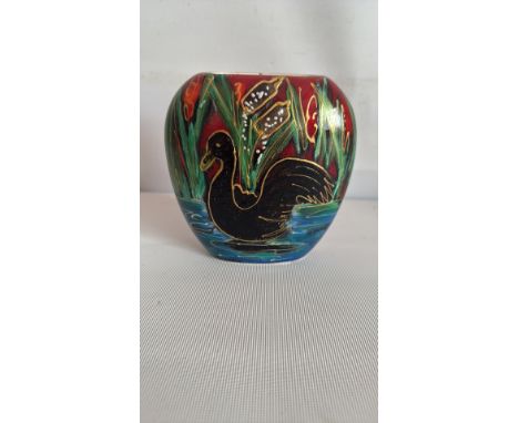 Anita Harris pottery vase featuring a black swan in vibrant enamel colors; from the mid-20th century. The vase has a folk-art