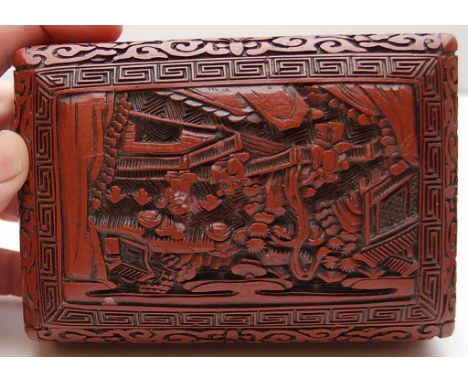 CHINESE RED CINNABAR BOX WITH INSET METAL SEAL TO BASE.