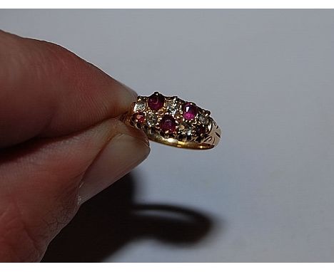 A RUBY AND DIAMOND RING, THE FIVE RUBIES ALTERNATING WITH THE FIVE DIAMONDS (SOME STONES VERY WORN) THE BAND MARKED 18CT. (RU