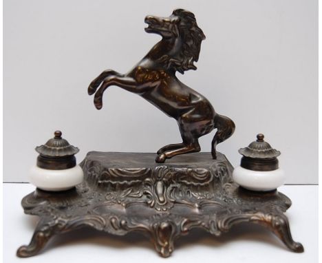 FRENCH BRONZE DESK STAND, WITH CERAMIC INKWELLS WITH A REARING HORSE FIGURE TO THE TOP.
