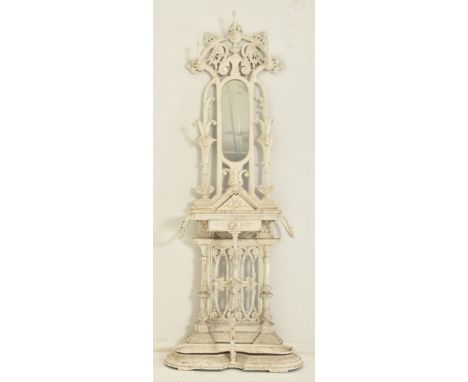 (ARR) A Victorian 19th century Coalbrookdale manner white painted cast iron hall umbrella stand. The stand having a central m