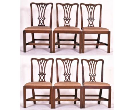 A set of six Chippendale inspired 19th century mahogany dining chairs. Each having a shaped back rest with carved floral deta