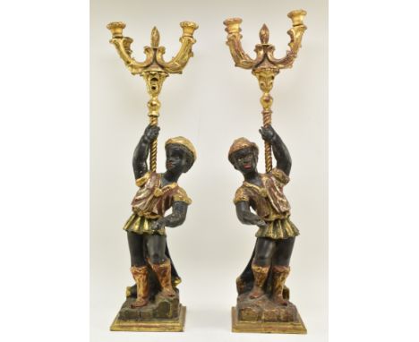 A pair of 19th century Victorian hand carved &amp; gilded Blackamoor figurines, each figured holding a four branch wooden cha