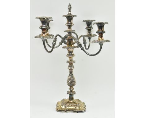 A mid 19th century Victorian four branch silver plated candelabra. The candelabra complete with finial snuff featuring centra