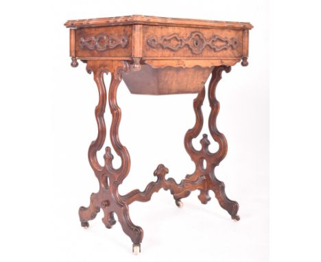 A High Victorian 19th century walnut lyre leg work ladies workbox sewing table. The table having a rectangular  shaped top wi