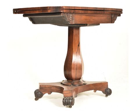A William IV 19th century rosewood fold top card games table. The table having a canted top opening to reveal a blue velvet c