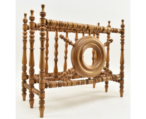 A 19th century Victorian turned walnut Aesthetic movement Canterbury magazine rack stand. The stand of North Country origin w
