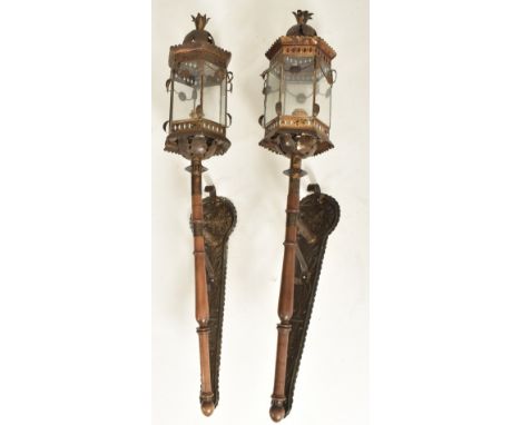 A pair of Continental early 20th century embossed bronzed metal &amp;  wooden wall lanterns / lights. Each lantern having hex