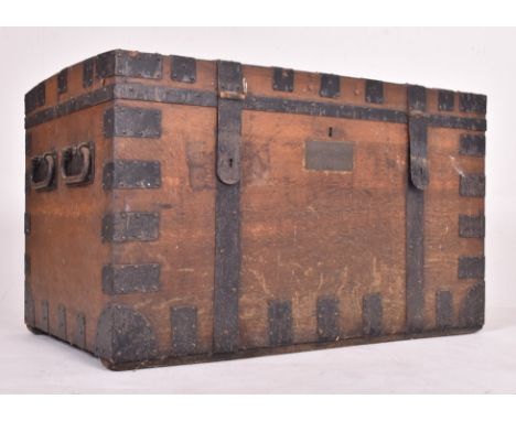 A large 19th century Victorian oak &amp; iron bound  campaign travel trunk chest. The trunk having a dome hinged top opening 