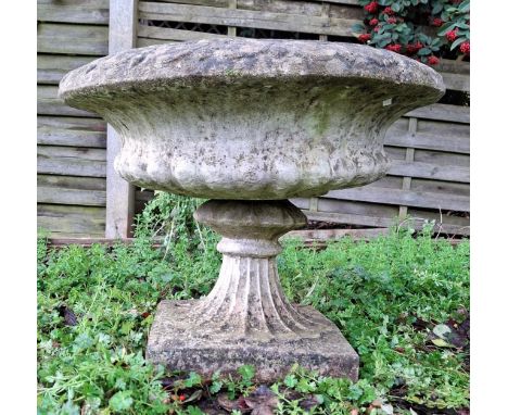 A large 20th century composite stone garden outdoor birdbath planter. The birdbath having a circular urn / dish top with deco