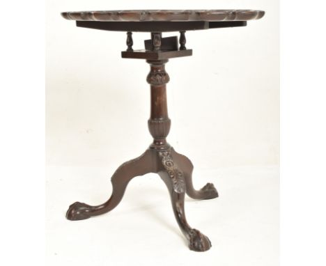 A 19th century carved mahogany birdcage mechanism side occasional tripod pedestal table. The table having having an oval top 