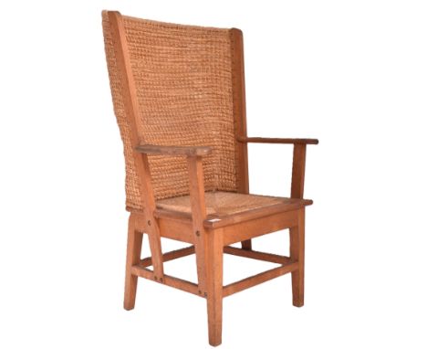 A Scottish Orkney Highland early 20th century oak &amp; seagrass woven rush back chair. The armchair with a curved woven back