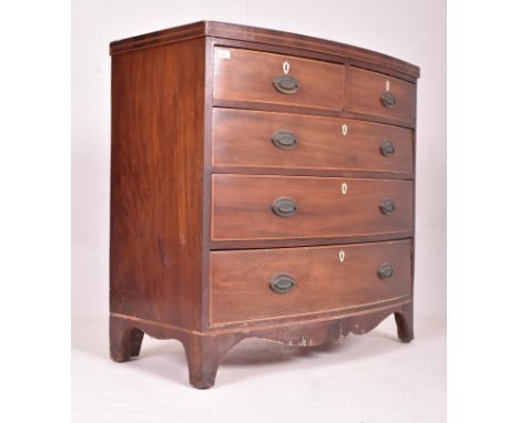 A George III 19th century mahogany inlaid bow front chest of drawers. The chest having a caddy top over a bank of two short o